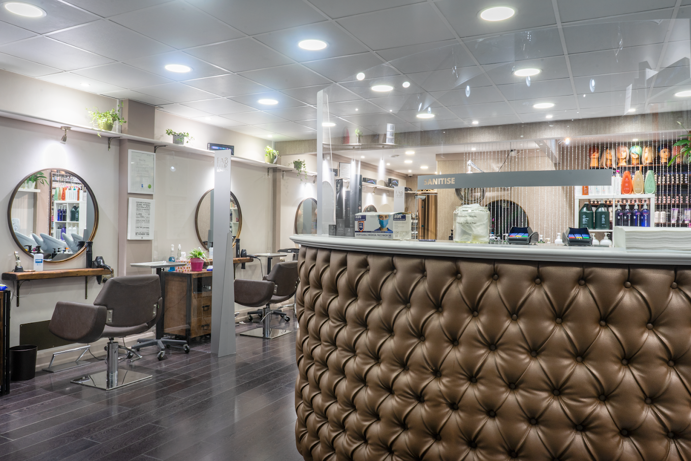 Fab Hair London salon reception area in Palmers Green, North London, showing modern interior design with professional hair salon furniture and styling stations
